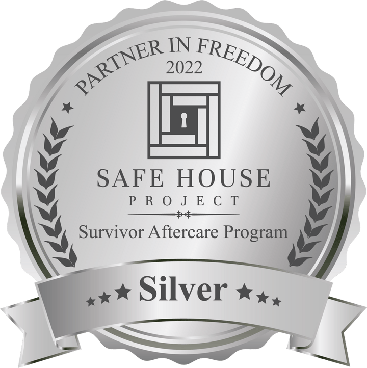 Safe House Certification Awards Silver Badge to Latisha’s House